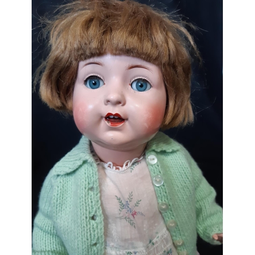 591 - 'Nicaput' doll, circa 1930's by König & Wernicke with blue closing eyes and 5 piece  body wearing a ... 