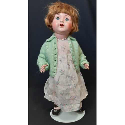 591 - 'Nicaput' doll, circa 1930's by König & Wernicke with blue closing eyes and 5 piece  body wearing a ... 