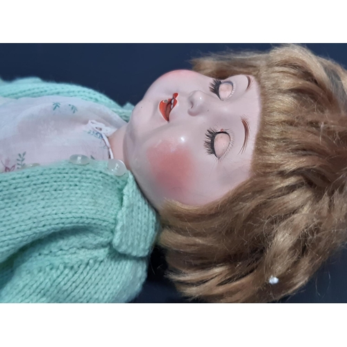 591 - 'Nicaput' doll, circa 1930's by König & Wernicke with blue closing eyes and 5 piece  body wearing a ... 