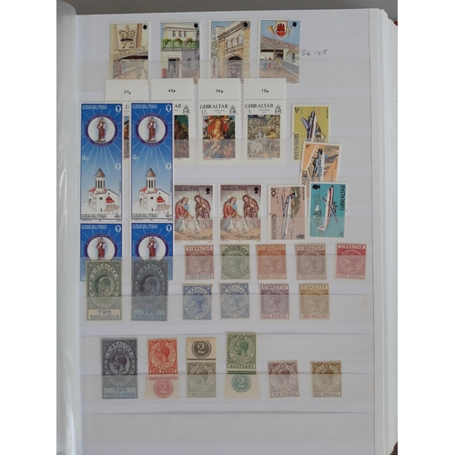 4 - A duplicated mostly Mint Gibraltar stamp collection in a stock album and loose.