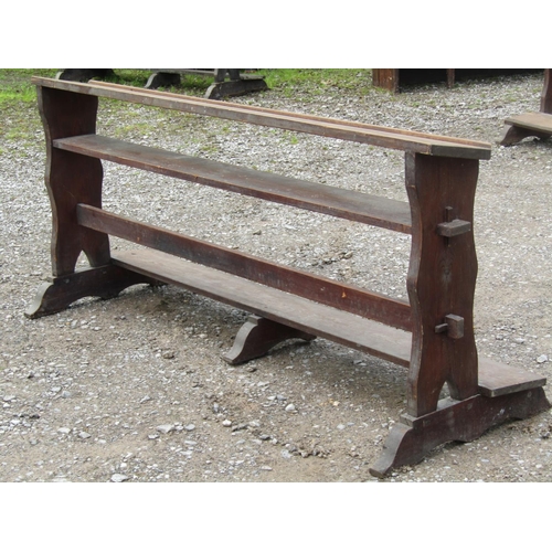 1023 - A stained pitch pine chapel prayer kneeling rail with pegged frame and sledge supports, 192 cm long ... 