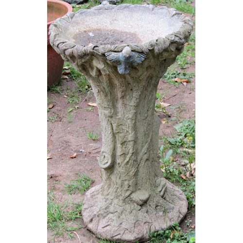 1095 - A novelty weathered cast composition stone bird bath in the form of a naturalistic tree trunk with f... 