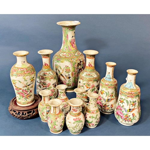 51 - Twelve 19th Century Chinese canton famille rose vases, one on stand: 24 cm (without stand) (12)