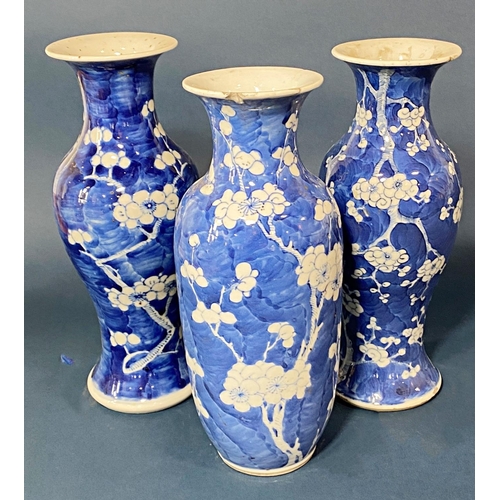 61 - Three Chinese blue and white porcelain prunus vases, each with four-character Kangxi mark to base, t... 