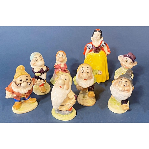 79 - A group of 6 Beswick and 1 Royal Doulton figures of Snow White and a mixture of dwarf's (there are 2... 