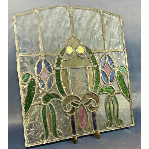 137 - An early 20th century leaded glass panel with colourful floral decoration, 45cm w x 50cm h