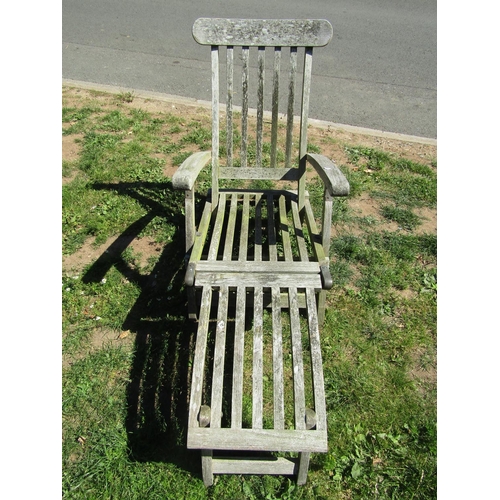 1114 - A good quality weathered contemporary hardwood folding steamer type garden chair with slatted seat, ... 