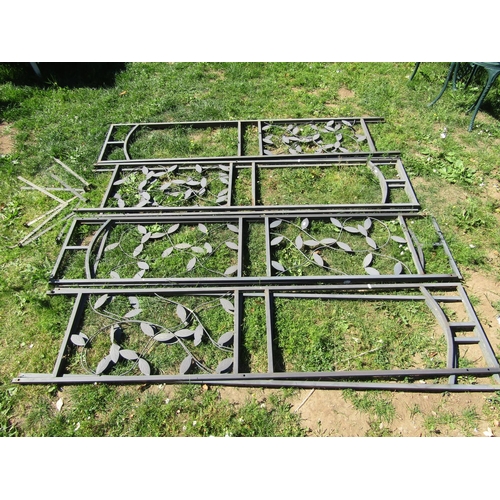 1115 - A run of seven contemporary coated cast aluminium garden panels with decorative scrolling vine detai... 