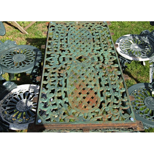 1049 - Four similar green painted cast aluminium garden chairs with decorative pierced geometric and foliat... 