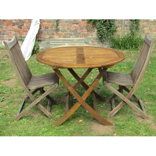 1063 - A contemporary Royal Craft stained hardwood circular folding garden table with slatted panelled top ... 