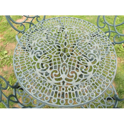 1065 - A contemporary green painted cast aluminium five piece garden terrace set comprising circular topped... 