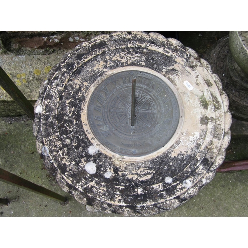 1069 - A weathered cast composition stone sundial with repeating flower head and rope twist detail beneath ... 