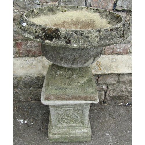 1082 - A weathered cast composition stone garden urn, the circular lobed bowl with flared rim and combined ... 