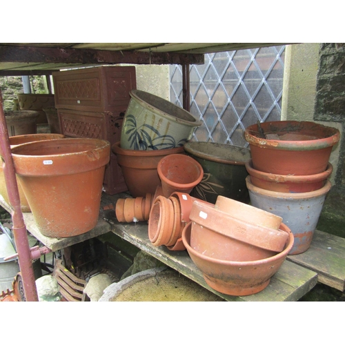 1091 - A quantity of mainly contemporary but weathered terracotta garden planters of varying size and desig... 