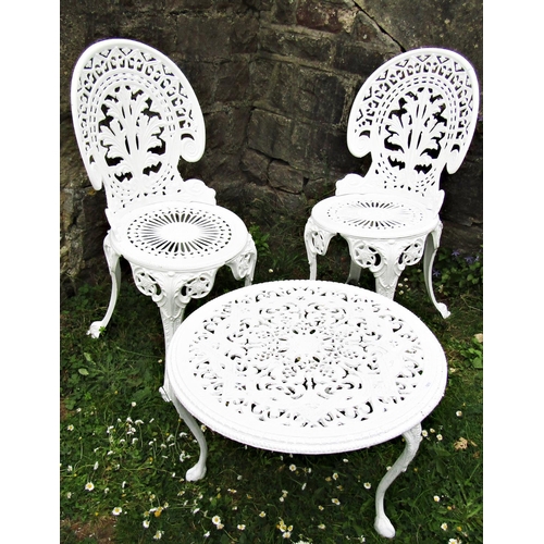 1094 - A pair of white painted cast aluminium garden chairs with decorative pierced geometric and floral de... 