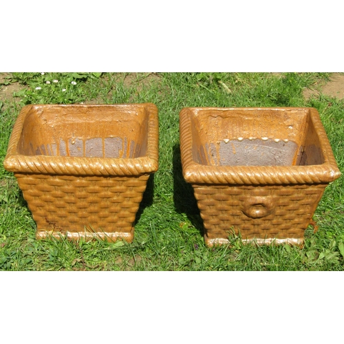 1098 - A pair of treacle glazed garden planters in the form of wicker baskets of square tapered form, 35 cm... 