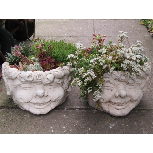 1104 - A pair of novelty comical head cast composition stone garden planters (planted) 23 cm high