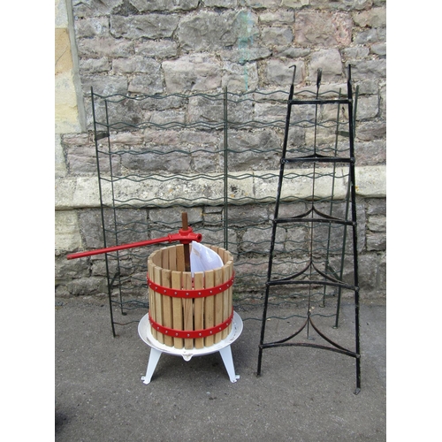 1144 - A small fruit press, wooden slatted and steel banded together with a vintage floorstanding five tier... 