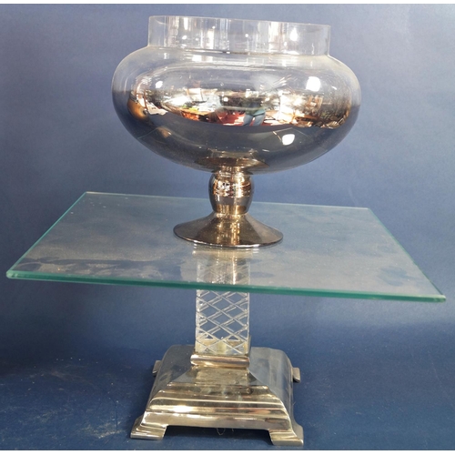 162 - A square glass cake stand raised on a square cut glass column on a silver plated stepped base, a mod... 