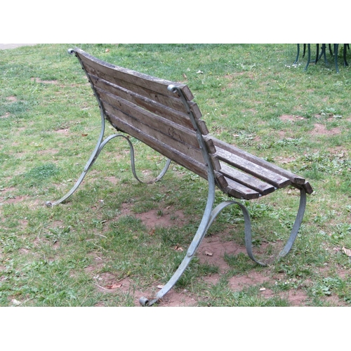 1116a - A vintage garden bench with weathered timber lathes raised on galvanized sprung steel supports 148cm... 