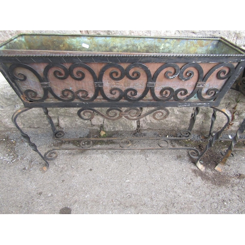 1123 - A pair of good quality decorative iron work freestanding planters of rectangular form with decorativ... 