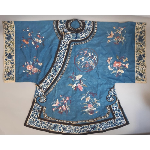 448 - Early 20th century Chinese/ oriental silk robe, unlined, with blue ground embroidered with floral sp... 