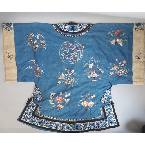 448 - Early 20th century Chinese/ oriental silk robe, unlined, with blue ground embroidered with floral sp... 