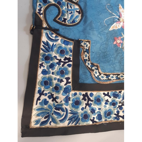 448 - Early 20th century Chinese/ oriental silk robe, unlined, with blue ground embroidered with floral sp... 