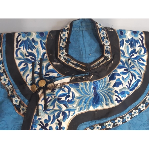 448 - Early 20th century Chinese/ oriental silk robe, unlined, with blue ground embroidered with floral sp... 