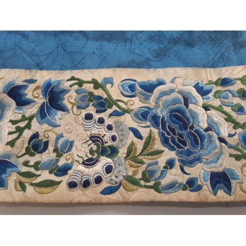 448 - Early 20th century Chinese/ oriental silk robe, unlined, with blue ground embroidered with floral sp... 