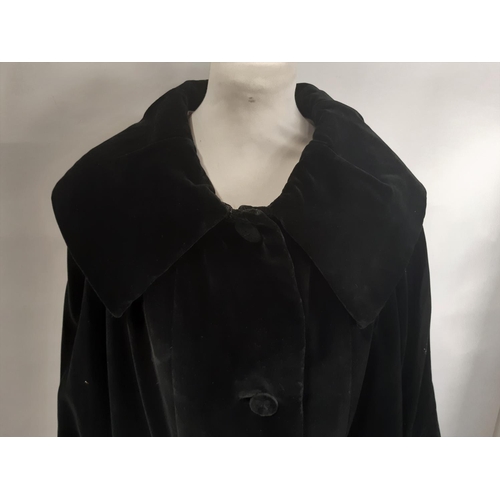 431 - Circa 1930's ladies black coat with wide collar, stiffened cotton velvet with swing back, ivory silk... 