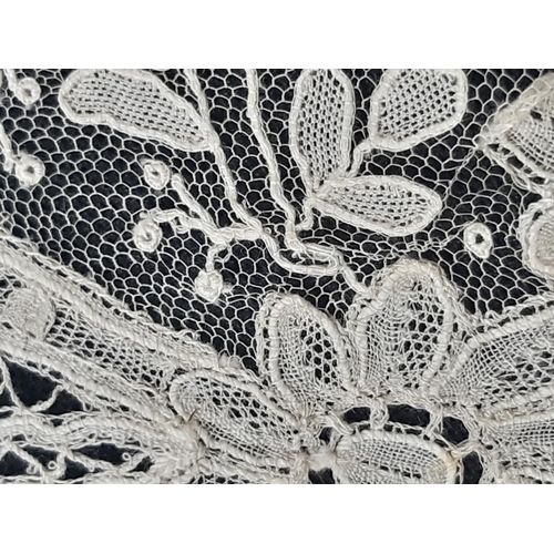 461 - 19th century lace bertha finely worked in a floral design with point de gaze type sections. Depth of... 