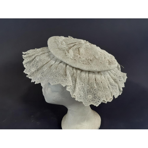 463 - Two Victorian white cotton hats elaborately sculpted with broderie anglais together with a starched ... 