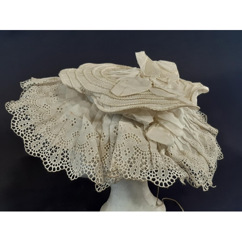 463 - Two Victorian white cotton hats elaborately sculpted with broderie anglais together with a starched ... 