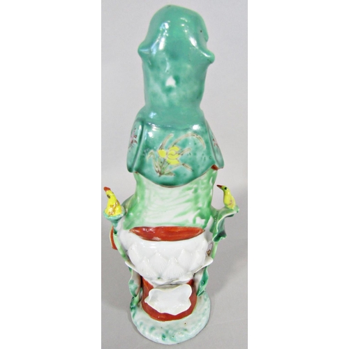 47 - A Chinese polychrome figure of Guan Yin, upon a Lotus flower base, 23cm high