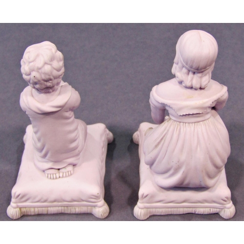 51 - A pair of Minton figures of crouching and praying children seated upon cushions, in a lilac colourwa... 