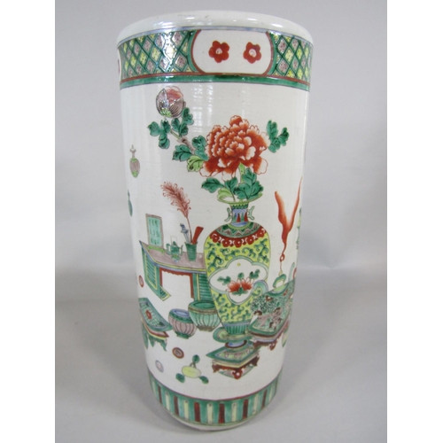 52 - A famille rose cylindrical stick stand with floral and device detail, 45cm tall