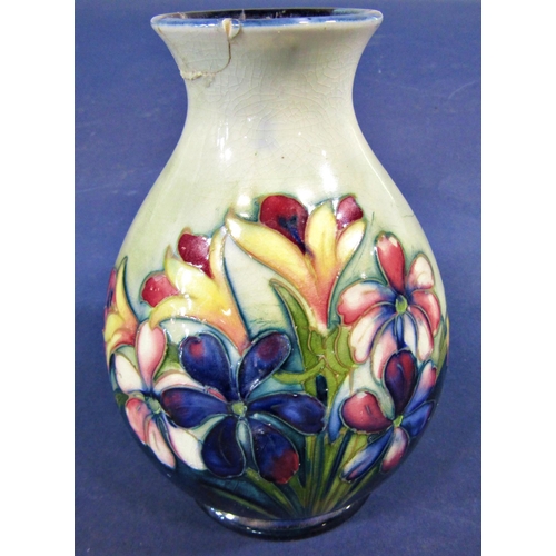 61 - A Moorcroft oviform vase with floral detail, 16cm (af to neck)