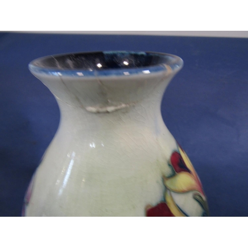 61 - A Moorcroft oviform vase with floral detail, 16cm (af to neck)