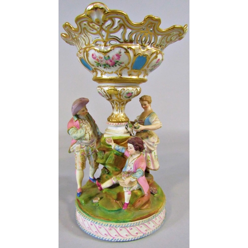 63 - 19th century continental bisque table centre of three characters around a central vase, (af) 26cm ta... 