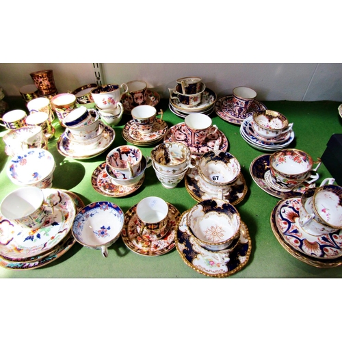 67 - A collection of 19th century Crown Derby and other cabinet cups and saucers with imari and other det... 