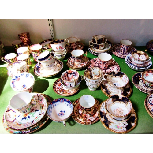 67 - A collection of 19th century Crown Derby and other cabinet cups and saucers with imari and other det... 