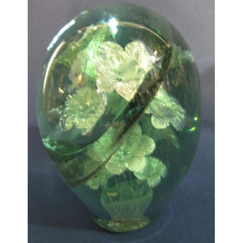 103 - A Mdina blue and green glass paperweight signed Mdina to base, green glass dump with internal daffod... 