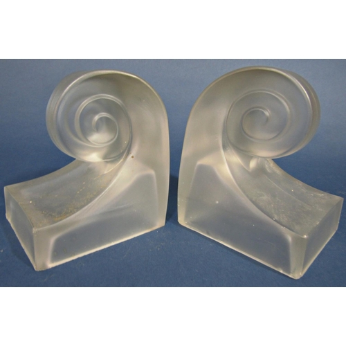 104 - A pair of frosted glass scrolled bookends on a square base, 12.5 high x 10cm wide