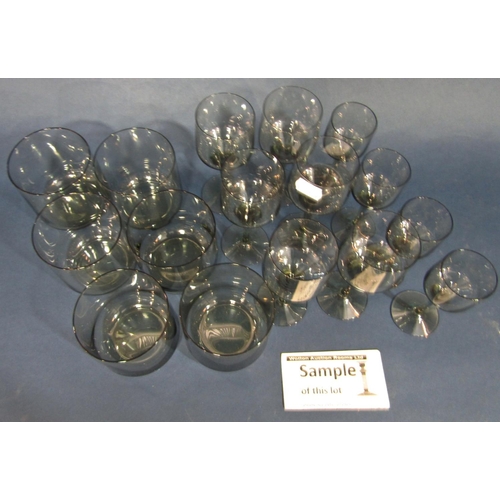 106 - Holmegaard style smoky glassware, including six tall wine glasses, six smaller aperitif glasses, fou... 