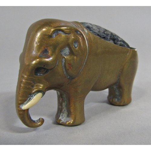 387 - A 19th century brass pin cushion in the form of an elephant