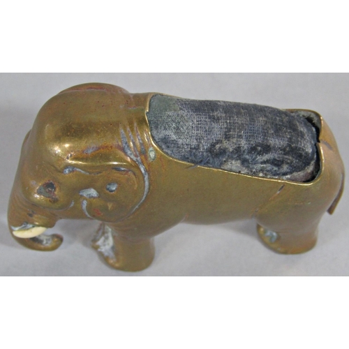 387 - A 19th century brass pin cushion in the form of an elephant