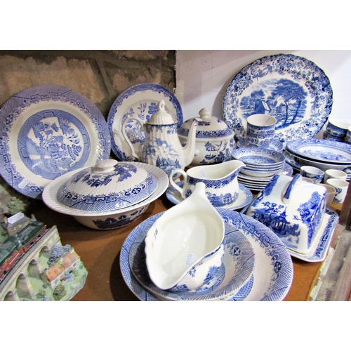 76 - A collection of contemporary blue and white table wares including tureen, meat plate, etc, together ... 