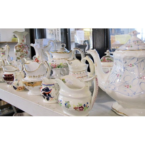 79 - A collection of 19th century ceramic teapots, sauce boats, cream and milk jugs from various factorie... 