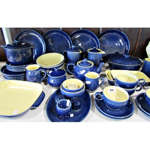 84 - A collection of Denby table wares in a blue colourway comprising dishes, bowls, teapot, milk jug, et... 